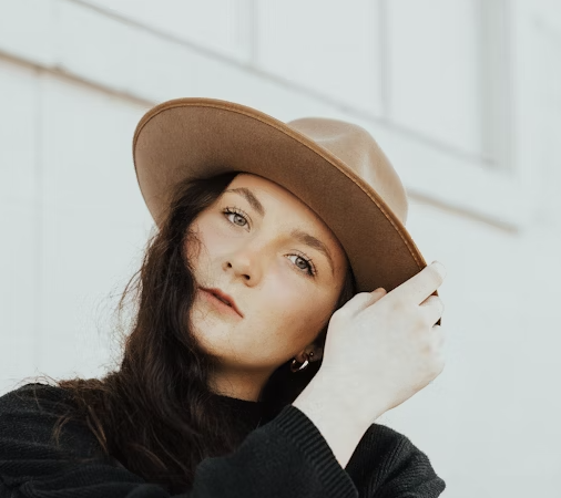 Woman in tan wide-brim hat
