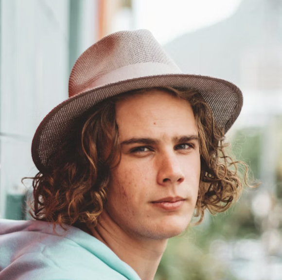 Man in brown fedora hat